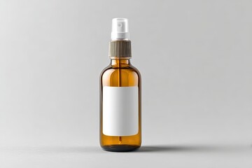 Amber glass spray bottle with a blank white label on a light gray background.