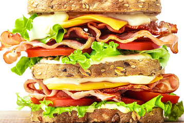 Double bacon, lettuce, tomato sandwich with cheese close up