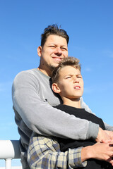 Obraz premium Father and teenager son spending time together outdoors