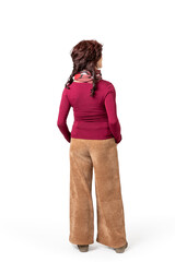 Woman standing still in sober trousers, seen from behind with white background.