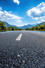 Asphalt Road Journey Leading to Mountain Range Under Blue Sky Scenic Landscape View Tranquil