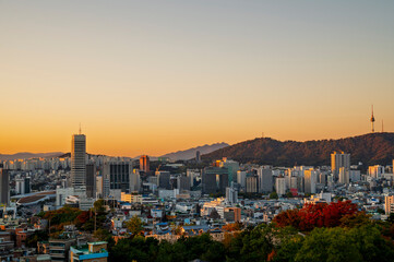 Gold sun risae or sunset of Seoul cityscapes with high rise office buildings and skyscrapers in Seoul city, Republic of Korea in winter season