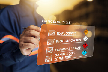 Safety officer tick check mark to inspect the list of dangerous goods before moved or...
