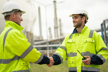 Engineer worker hand shaking to colleagues team for success work at construction site of...