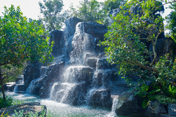 Garden Waterfalls in slow shutter,summer some small waterfall at a Japanese Garden,rest in park,mountain river stream waterfall green forest,nature plant tree rainforest..