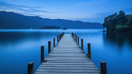 Fototapeta premium Serene twilight at lake Atitlan Guatemala with wooden pier leading to calm water and starry sky reflecting tranquil mood of nature and peaceful travel destination