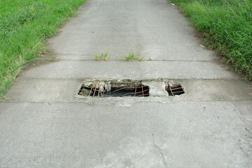 Damaged concrete road with holes