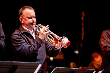 Trumpet Solo. A big band jazz trumpet player takes a stand to play a solo.