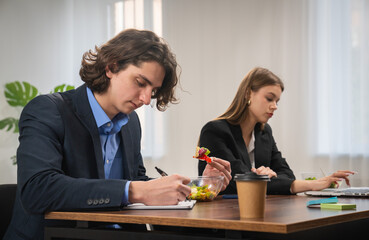 Office Work Scene with Professionals Busy at Their Desks