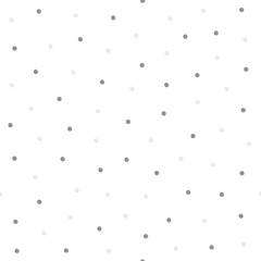 A seamless pattern with dots painted grey on a white background