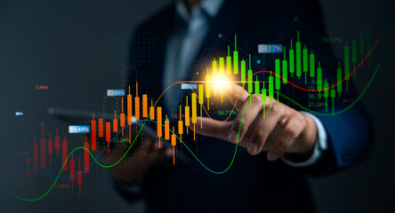 Businessman analyzing market trends and financial graph on virtual technology. Represent real time trading data,Fintech,Investment planning,Economic performance forecasting for strategic growth..