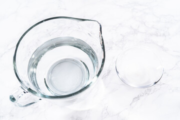 Measuring Glass Cups Filled with Water for Preparation
