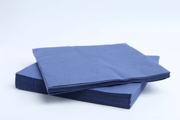 Many blue paper handkerchiefs isolated on white