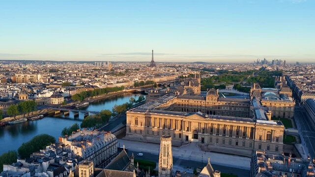Stunning aerial view showcases Parisian landmarks, including the iconic Eiffel Tower, elegantly framed at sunrise. France