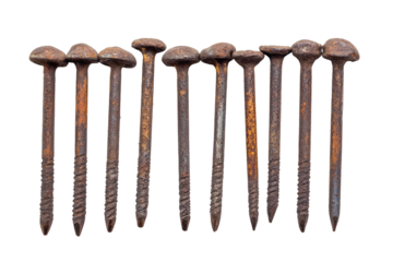 Rusty metal nails arranged in a row on a white background, showcasing their worn texture and details for construction or DIY projects. on transparent background