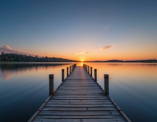 Fototapeta premium Wooden pier extending into calm lake at sunset.