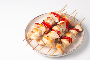 Grilled chicken skewers. Satay with side lemon and salad. Kebab with sauces. 