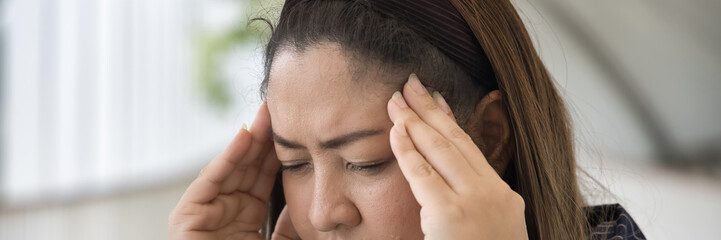 Serious and stressful middle age woman having stress-type headache and muscle tension health problem, concept image for physical and mental health care