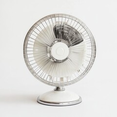 Retro-style table fan with a white background,