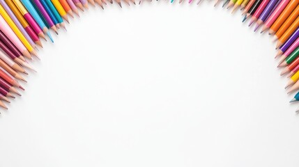 Colorful pencils arranged in an arc shape on a white background