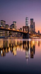 Fototapeta premium City skyline reflected in calm water at dawn