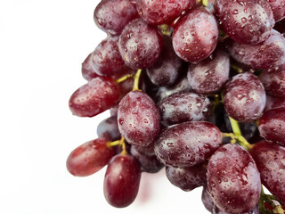 Fresh ripe blue grapes isolated on white background