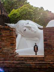 Wat Yai Chaimongkol, one of the UNESCO World Heritage place Ayudhaya, Thailand, ancient pagoda and buildings with surrounding a lot of buddha statues in outdoor under blue sky in summer