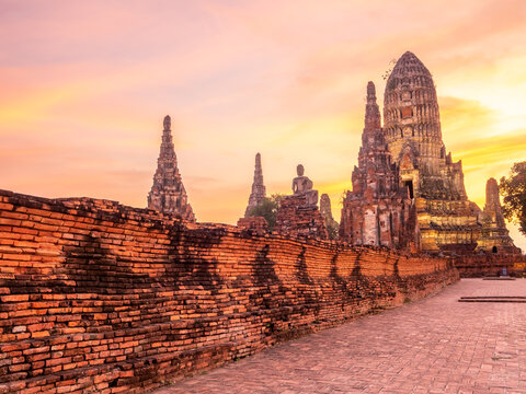 Wat Chaiwatthanaram, one of the part of UNESCO World Heritage place in Ayudhaya, Thailand, stupa, pagoda, ancient buildings under twilight evening sky - Powered by Adobe