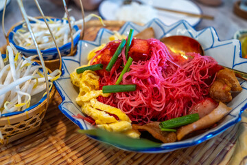 Red noodle in old fashioned Thai style menu, was served in traditional Thai food restaurant with decoration in old style