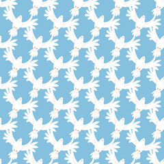 Seamless pattern of white doves for the religious holiday Pentecost on a blue background