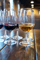 port wine testing, glasses with drink samples in bar