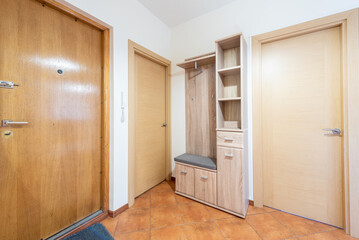 Modern Home Entryway Interior with Wooden Doors and Functional Furniture Setup