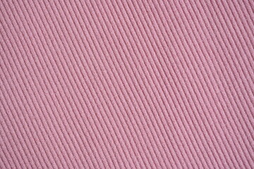  pink texture of knitted synthetic fabric as a background, pink smooth symmetrical lines of synthetic fabric 