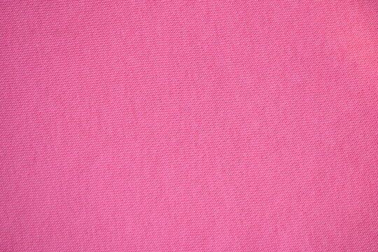 Pink fleece fabric texture, macro texture fleece pink fabric photo above as background	
