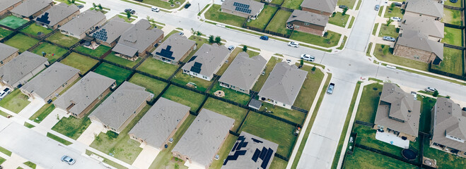 Panorama aerial view spacious backyard grassy lawn of new construction houses in fast growing...
