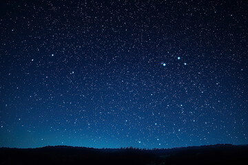 A captivating scene of stars shining against a black background, creating a night sky effect.