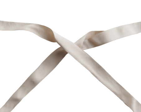 Elegant cream ribbon folded into a triangle shape with its ends isolated against a sleek background, creating a visually interesting design element