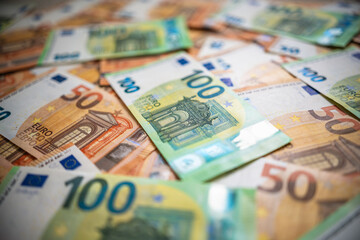 Euro money banknotes blurred background. Shallow depth of field. 