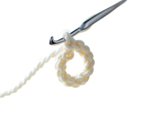 Intricate crochet artistry captured in a minimalist composition featuring a shiny silver crochet hook and a delicate, partially formed loop of pristine white yarn