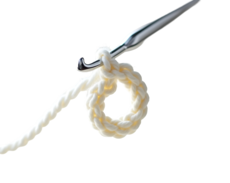 Intricate crochet artistry captured in a minimalist composition featuring a shiny silver crochet hook and a delicate, partially formed loop of pristine white yarn