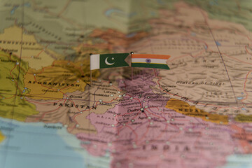 Pakistan and India flags on map showing political tension, conflict, and border disputes