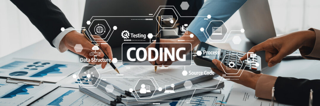 Hands of diverse professionals collaborating on coding project with charts, data analysis, and technology concepts in a modern office environment. Amity