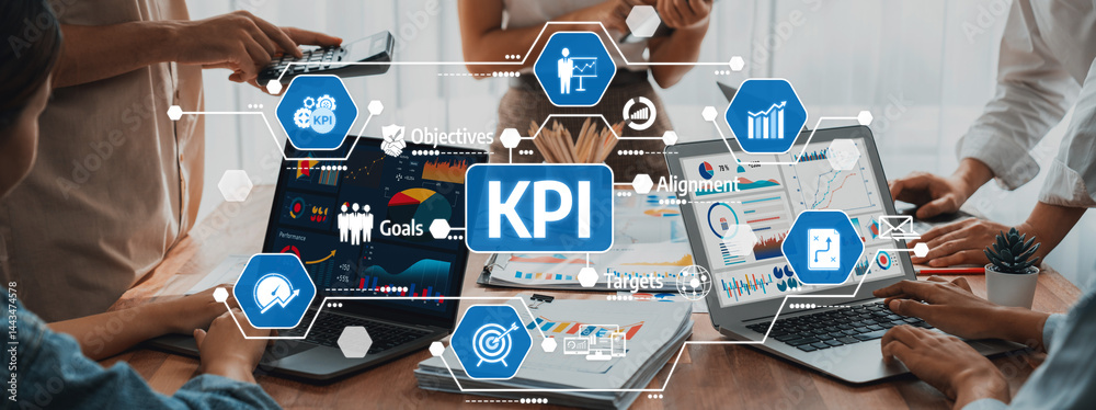 Fototapete a modern office scene showcasing collaboration on key performance indicators with laptops, charts, a