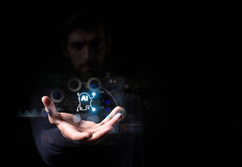 A man presents a glowing AI icon with digital interface graphics, symbolizing artificial intelligence, innovation, and future technology.