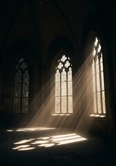 Obraz premium Sunlight through a Gothic window creates a striking visual, emphasizing the architectural details of the stone structure.