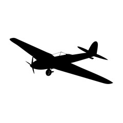 A dramatic silhouette of a classic World War II fighter plane