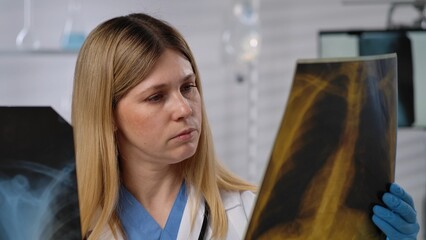 Medical Professional Analyzing Chest X Ray Image in Laboratory Setting