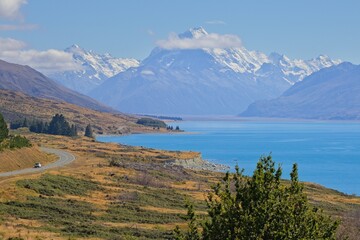 Fototapeta premium Scenic Mountain Lake with Winding Road