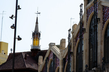 Close-up view of the beautiful architecture of a famous market in Valencia featuring stained glass...