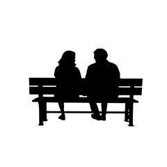 Silhouette of a couple sitting on a bench in a romantic scene
